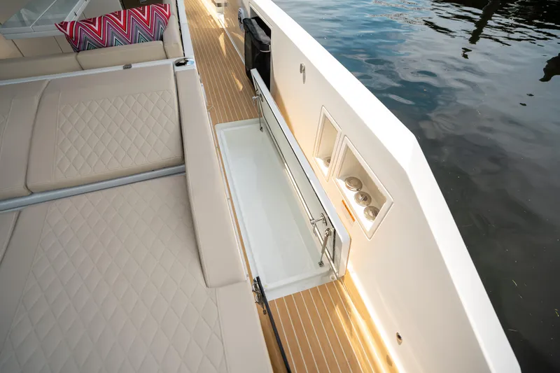  Yacht Photos Pics 2025 De Antonio Yachts D42 Open deck with luxurious seating and sleek design.