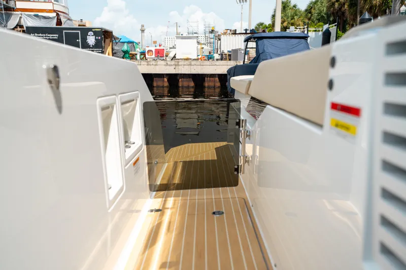  Yacht Photos Pics 2025 De Antonio Yachts D42 Open docked, showcasing sleek deck design and modern features.