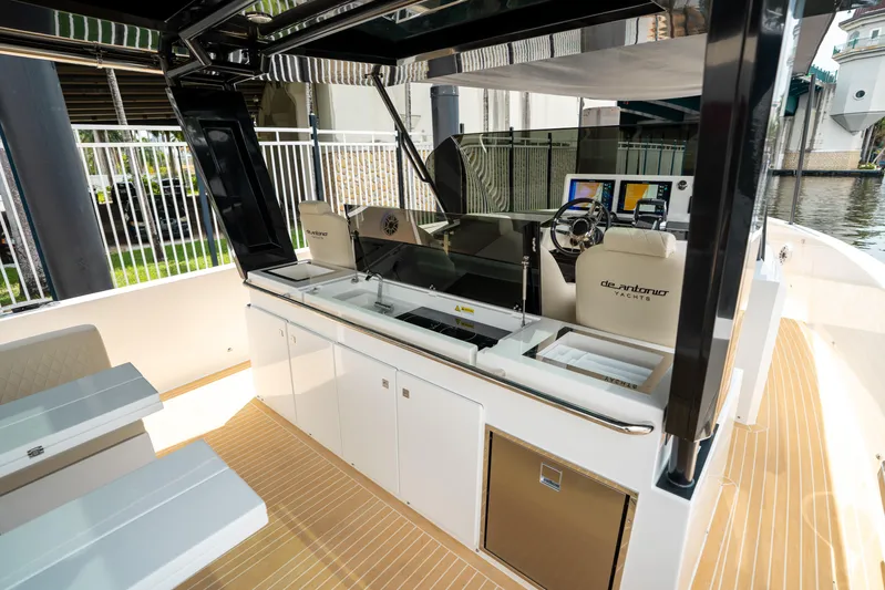  Yacht Photos Pics 2025 De Antonio Yachts D42 Open interior with modern helm and seating area.