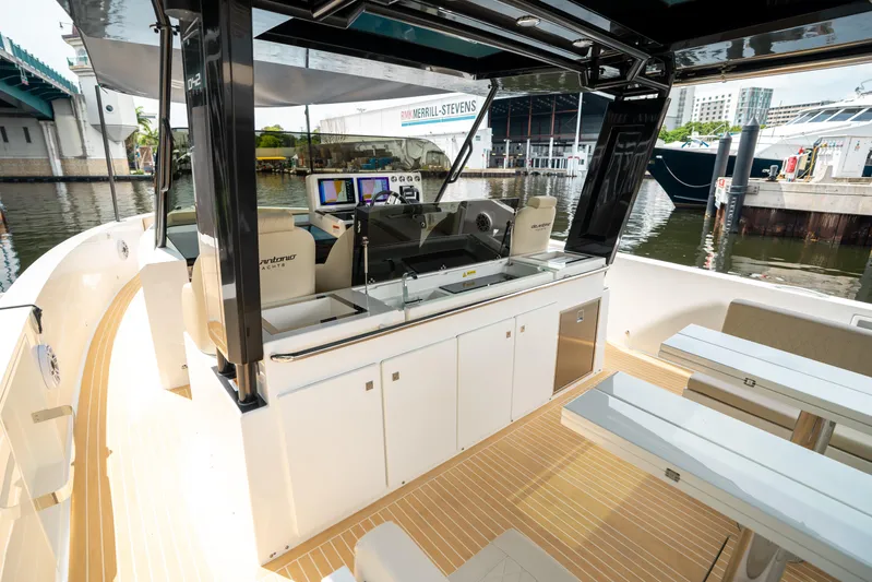  Yacht Photos Pics 2025 De Antonio Yachts D42 Open interior with modern helm and seating area.