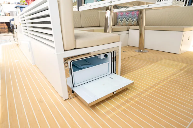  Yacht Photos Pics 2025 De Antonio Yachts D42 Open interior with open storage compartment on deck.