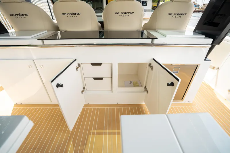  Yacht Photos Pics 2025 De Antonio Yachts D42 Open interior with open storage compartments and seating.
