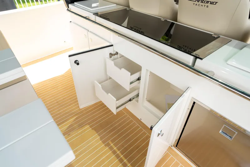  Yacht Photos Pics 2025 De Antonio Yachts D42 Open interior with open storage compartments and sleek design.