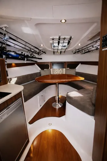 Cast Strength Yacht Photos Pics Interior of 2016 Pursuit OS 345 Offshore with cozy seating area.