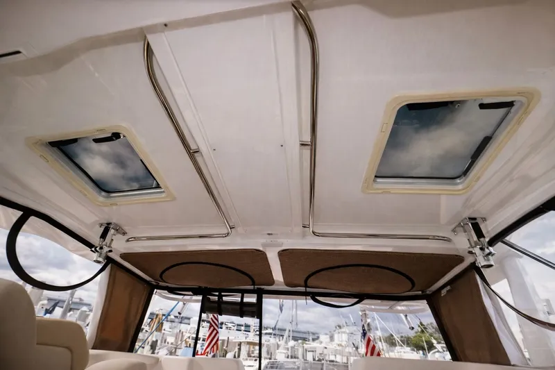 Cast Strength Yacht Photos Pics Interior of 2016 Pursuit OS 345 Offshore with skylights.
