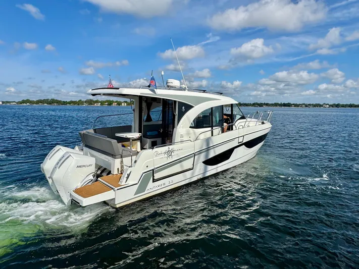  Yacht Photos Pics 2024 Beneteau Antares 11 cruising on a sunny day with clear skies.