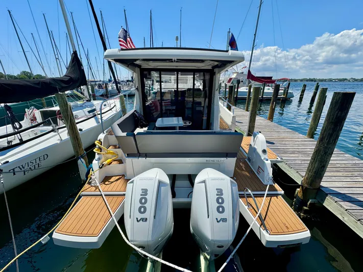  Yacht Photos Pics 2024 Beneteau Antares 11 docked, featuring twin 300 V8 engines, in a marina setting.