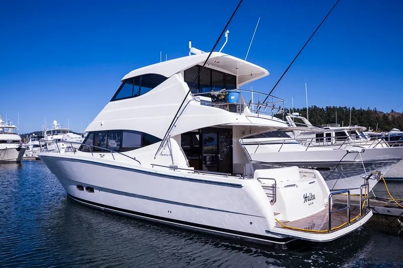  Yacht Photos Pics Luxury 2017 Maritimo M 51 yacht docked in marina under clear blue sky.