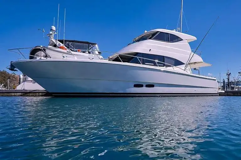  Yacht Photos Pics Luxury 2017 Maritimo M 51 yacht docked in a marina under clear blue skies.