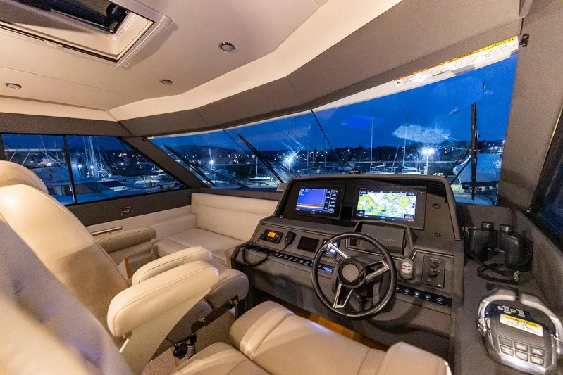  Yacht Photos Pics Luxurious 2017 Maritimo M 51 yacht cockpit with modern navigation systems at night.