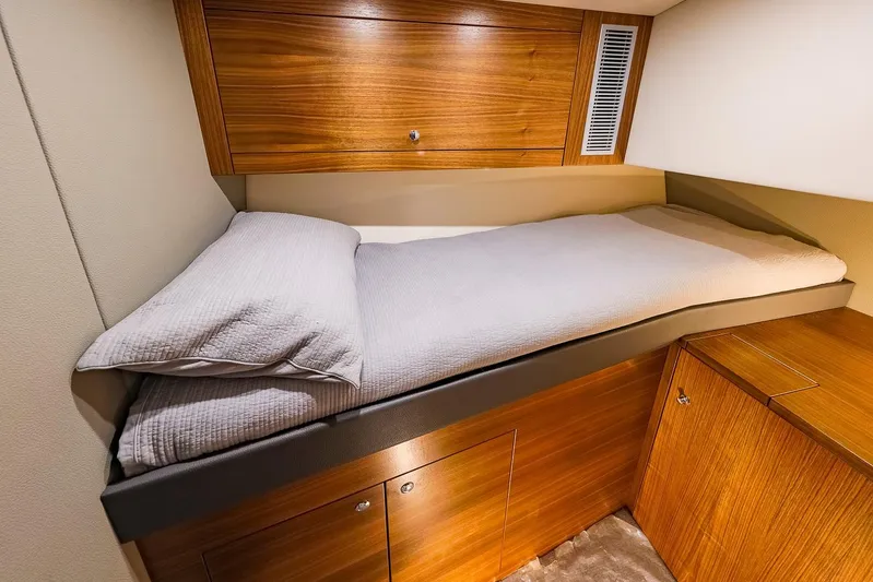  Yacht Photos Pics Luxurious cabin interior of 2017 Maritimo M 51 yacht with wooden cabinetry.