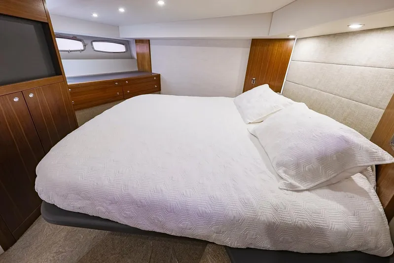 Yacht Photos Pics Luxurious bedroom interior of 2017 Maritimo M 51 yacht with elegant wood finishes.