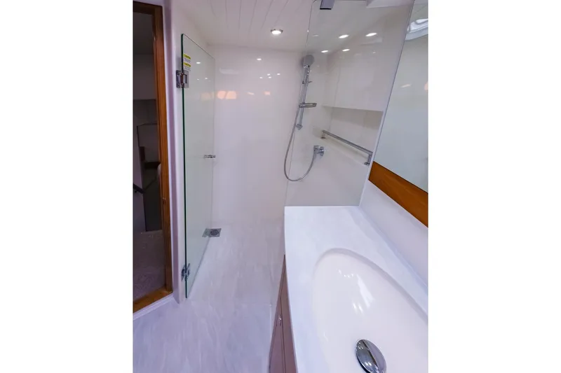  Yacht Photos Pics 2017 Maritimo M 51 yacht bathroom with modern shower and sleek sink design.