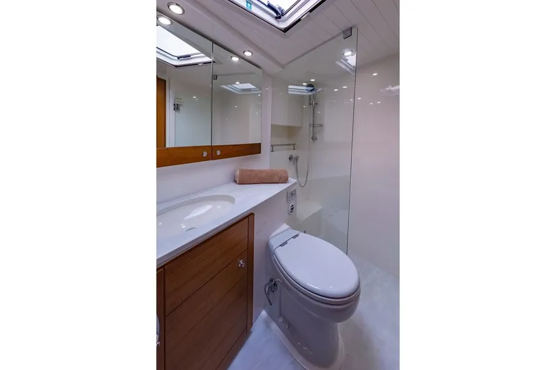  Yacht Photos Pics Luxurious bathroom in 2017 Maritimo M 51 yacht with modern fixtures and elegant design.