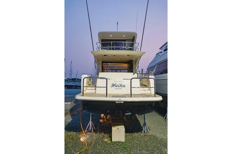  Yacht Photos Pics 2017 Maritimo M 51 yacht docked at sunset, rear view.