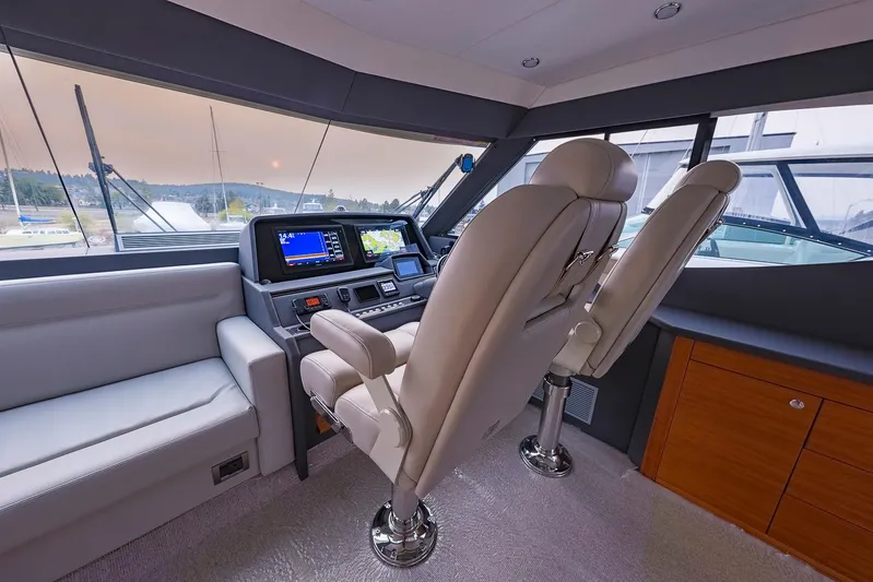  Yacht Photos Pics Luxurious 2017 Maritimo M 51 yacht helm with plush seating and advanced navigation system.