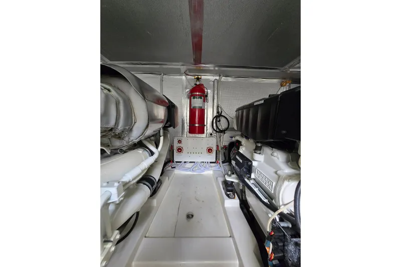  Yacht Photos Pics Engine room of 2017 Maritimo M 51 yacht with fire extinguisher and machinery.