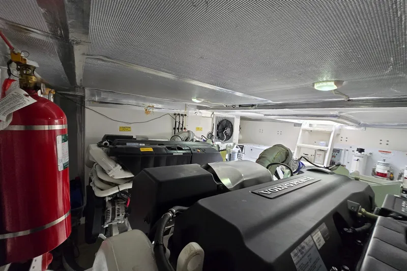  Yacht Photos Pics Engine room of 2017 Maritimo M 51 yacht with Volvo Penta engine and fire extinguisher.