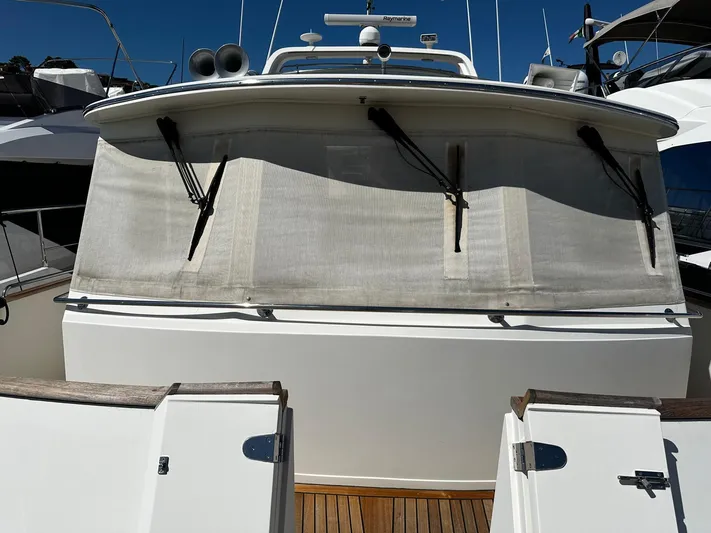 Smaragd Yacht Photos Pics 2003 Fleming 55 yacht with covered windows and deck view.