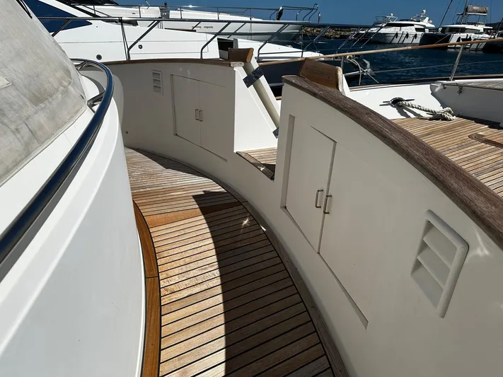 Smaragd Yacht Photos Pics Curved deck of a 2003 Fleming 55 yacht with wooden flooring.