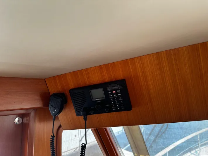 Smaragd Yacht Photos Pics VHF radio and microphone on 2003 Fleming 55 yacht's wooden interior panel.