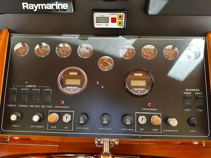 Smaragd Yacht Photos Pics Control panel of a 2003 Fleming 55 yacht with gauges and switches.