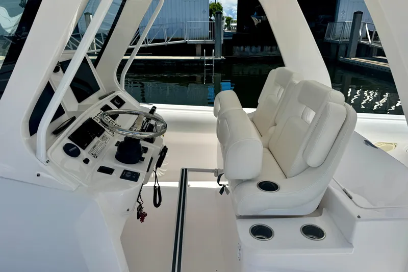  Yacht Photos Pics 2019 Intrepid 407 Panacea helm with white seating and modern controls.