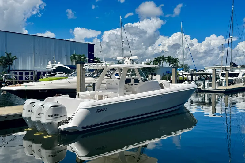  Yacht Photos Pics 2019 Intrepid 407 Panacea boat docked at marina with clear blue sky.