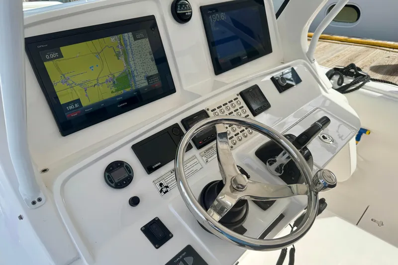  Yacht Photos Pics Control panel of a 2019 Intrepid 407 Panacea boat with navigation screens.