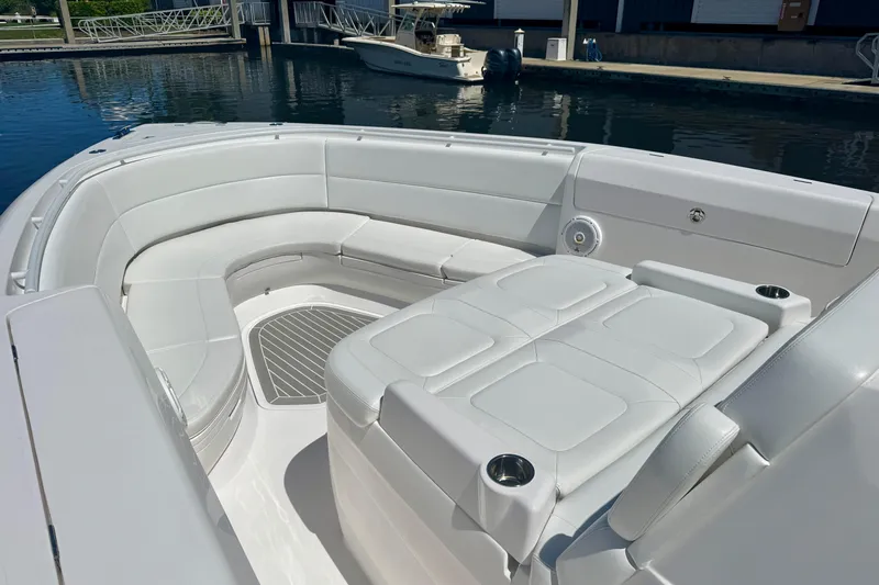  Yacht Photos Pics Luxurious seating area on a 2019 Intrepid 407 Panacea boat docked by the water.