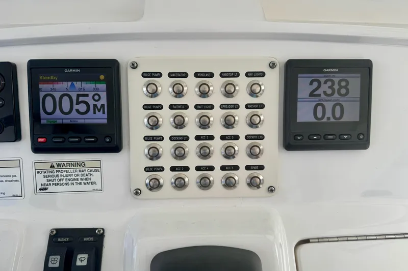  Yacht Photos Pics Control panel of a 2019 Intrepid 407 Panacea boat with Garmin displays and switches.