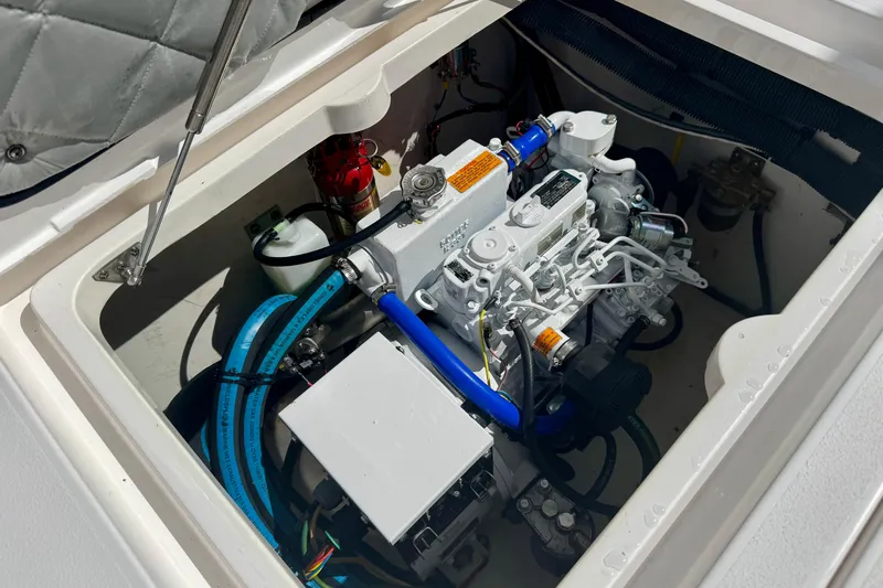  Yacht Photos Pics Engine compartment of 2019 Intrepid 407 Panacea boat, showcasing mechanical components and wiring.
