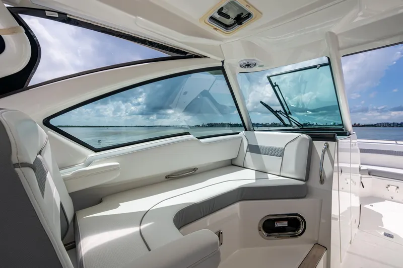  Yacht Photos Pics 2021 Pursuit DC 326 Dual Console interior with luxurious seating and ocean view.