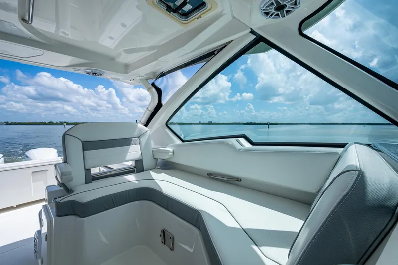  Yacht Photos Pics Interior view of 2021 Pursuit DC 326 Dual Console boat with ocean backdrop.