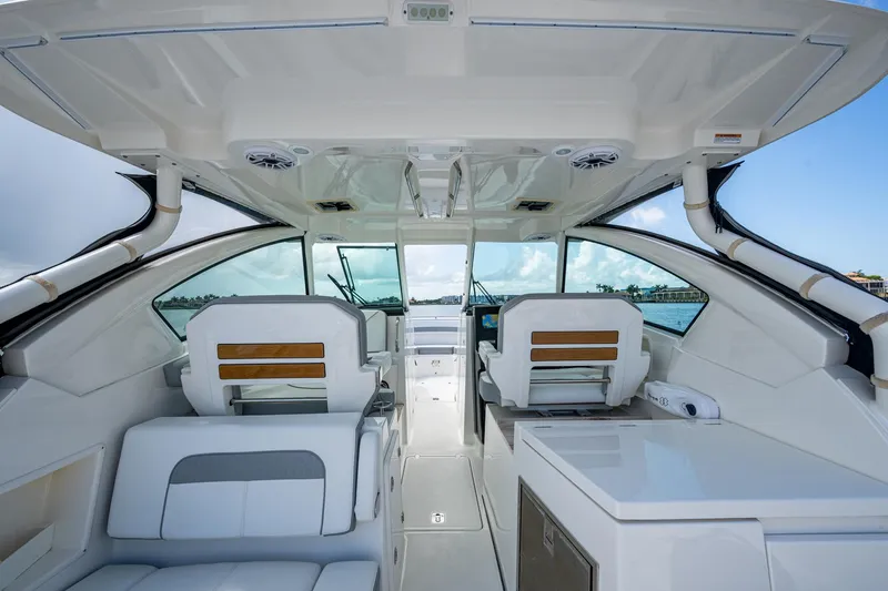  Yacht Photos Pics 2021 Pursuit DC 326 Dual Console interior with modern seating and ocean view.