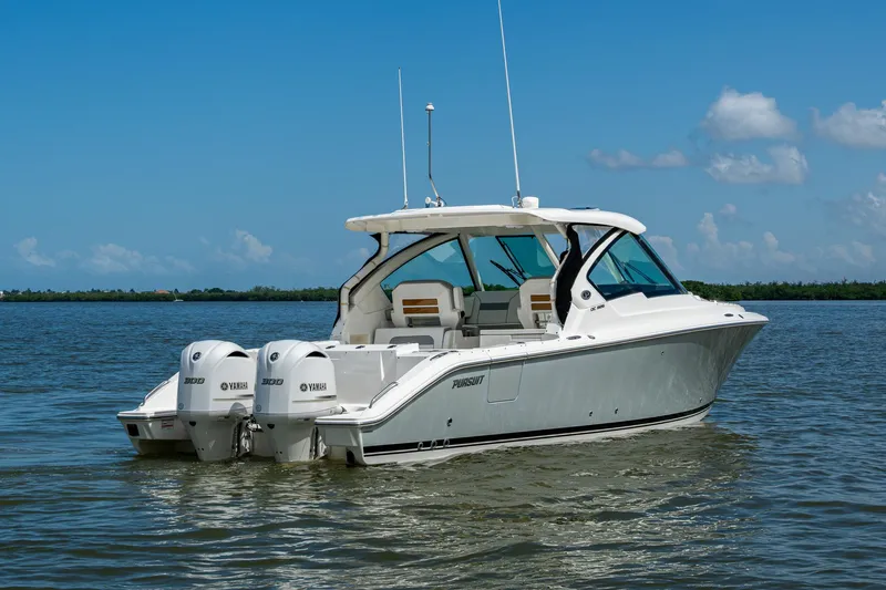  Yacht Photos Pics 2021 Pursuit DC 326 Dual Console boat on calm water, featuring twin Yamaha engines.