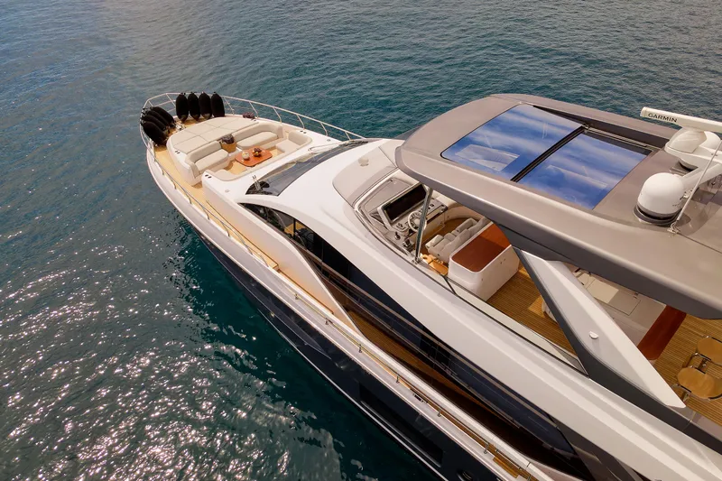  Yacht Photos Pics Luxury Azimut 78 yacht, 2022 model, cruising on clear blue water.