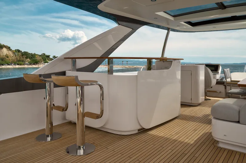  Yacht Photos Pics Luxurious 2022 Azimut 78 yacht deck with modern bar and seating area.