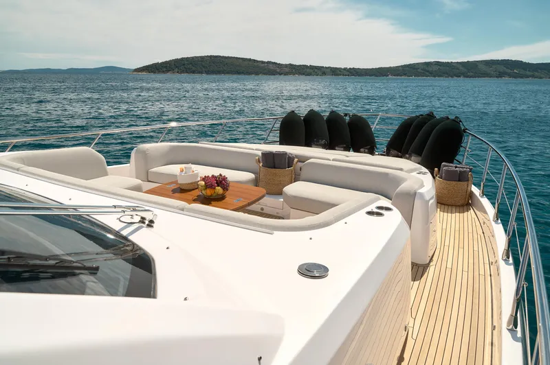  Yacht Photos Pics Luxurious 2022 Azimut 78 yacht deck with elegant seating and ocean view.