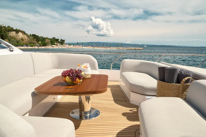  Yacht Photos Pics Luxurious 2022 Azimut 78 yacht deck with elegant seating and ocean view.