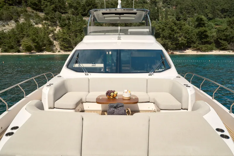  Yacht Photos Pics Azimut 78 yacht 2022 model with luxurious deck seating and scenic water backdrop.