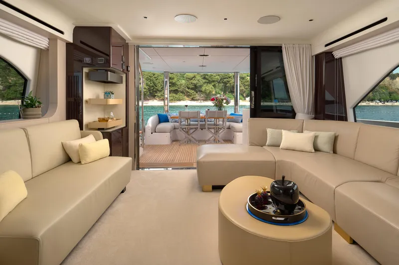  Yacht Photos Pics Luxurious interior of 2022 Azimut 78 yacht with elegant seating and scenic outdoor view.