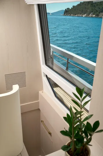  Yacht Photos Pics Interior view of 2022 Azimut 78 yacht with ocean and island scenery.