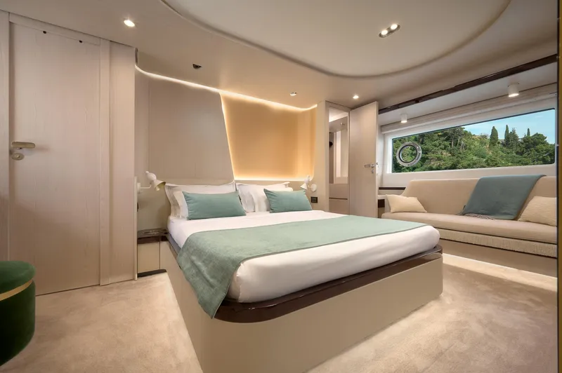  Yacht Photos Pics Luxurious bedroom interior of 2022 Azimut 78 yacht with modern design and large window view.