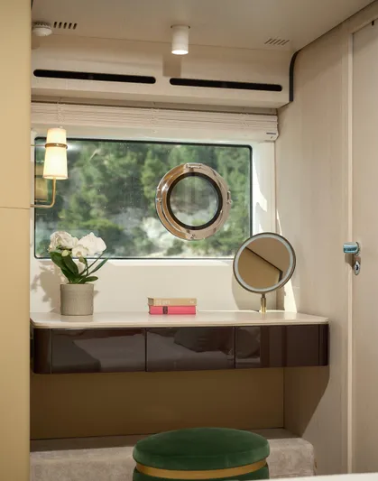  Yacht Photos Pics Luxurious interior of 2022 Azimut 78 yacht with vanity, mirror, and porthole window.