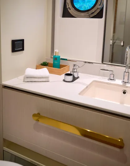  Yacht Photos Pics Luxury bathroom in 2022 Azimut 78 yacht with modern sink and porthole window.