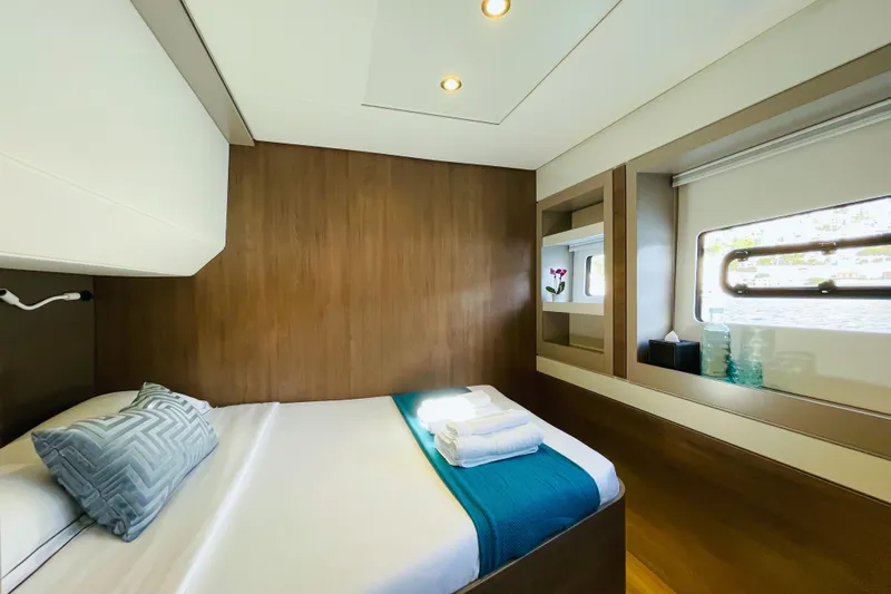 Signature Bali 5.4. (6+ 2 Cabins) Yacht Photos Pics Luxurious cabin interior of 2022 Bali 5.4 yacht with modern decor and natural light.