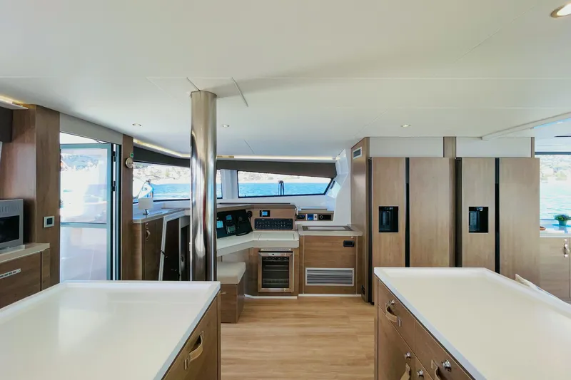 Signature Bali 5.4. (6+ 2 Cabins) Yacht Photos Pics Luxurious interior of 2022 Bali 5.4 yacht with modern kitchen and panoramic windows.