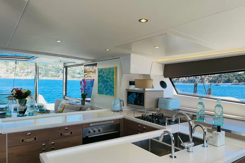 Signature Bali 5.4. (6+ 2 Cabins) Yacht Photos Pics Luxurious Bali 5.4 yacht interior with modern kitchen and scenic ocean view, 2022 model.