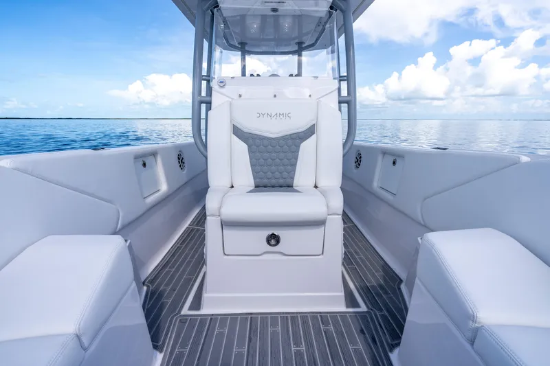  Yacht Photos Pics Luxury interior of 2023 Dynamic D-305V boat with sleek seating and ocean view.
